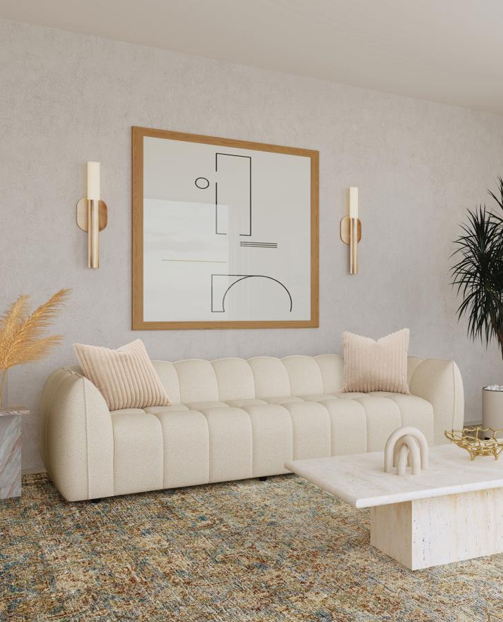 Cuddle up in stylish comfort with this modern extra-long sofa, a perfect interior focal point with its fun bubble-like design. The sofa shows off boucle upholstery in a sand pebble hue, adding an inviting warmth to your dÃ©cor. It-'s incredibly comfortabl
