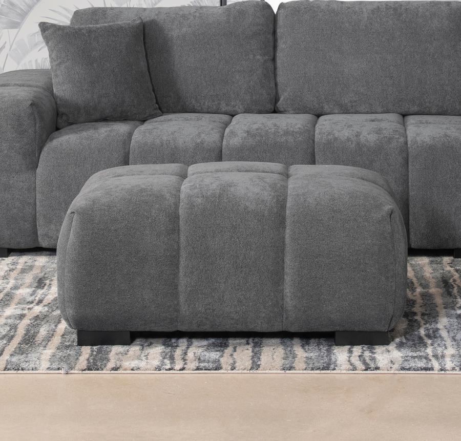 Add versatility and comfort to your seating area with this plush, mid-century inspired ottoman. Its soft, neutral upholstery and subtle grid tufting bring depth and texture to your dÃ©cor, while a sturdy frame ensures lasting durability. Ideal as a footre