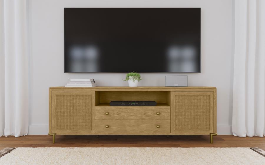 This refined entertainment unit transforms your living room with artisanal detail. Accommodating up to 85-inch displays, this TV stand integrates Asian hardwood, engineered wood, ash veneer, and rattan. A modern neutral finish and aged brass legs exude ti