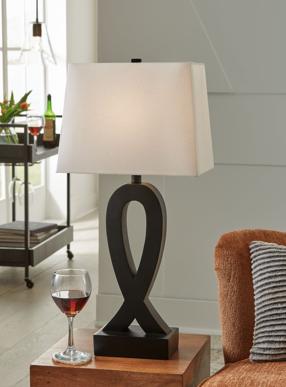 The graceful curves of this table lamp add a unique sculptural element to your interior. Use it anywhere you need a cool, modern touch of style.<br><br><b>Additional Dimensions</b><br><ul><li>Base: 0-"</li><li>Shade: 0-"</li><li>Cord length: 98.5-"</li></