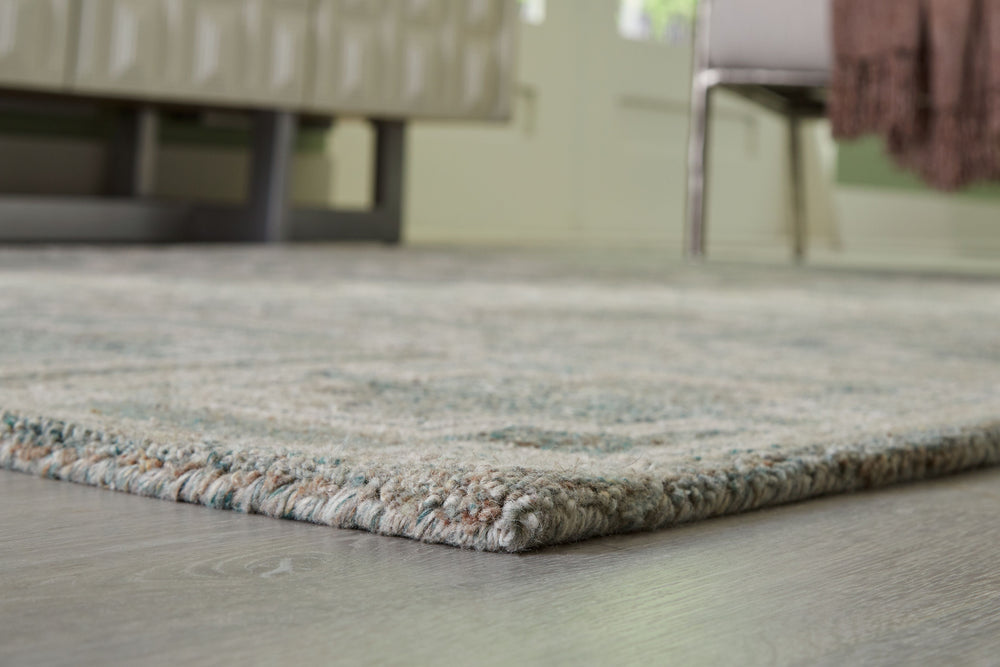 Tie your room together with the elegant character of this rug. Its timeless geometric design in muted tones provides a versatile foundation for interiors ranging from casual to modern. Youâ€™ll love the way the intricate design grounds your space without 
