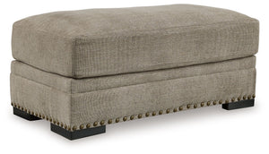 Looking to enhance your home-'s visual appeal? This ottoman offers sophisticated design, comfort and elegance with tonal colors and nailhead accents. Enjoy optimal coziness with luxurious soft upholstery and a feather-blend cushion. Perfect for modern spa