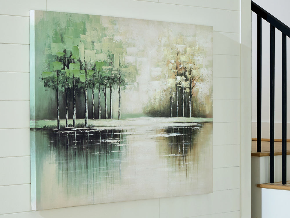 This wall art incorporates a touch of serene style into your decor. Trees are reflected in the rippling water of the foreground, crafting a peaceful landscape youâ€™ll love to get lost in. With its green, tan and white hues, itâ€™s a welcome addition to c