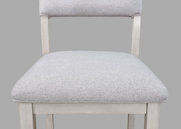  designed for both casual meals and lively gatherings. The round tabletop features a charming weathered finish