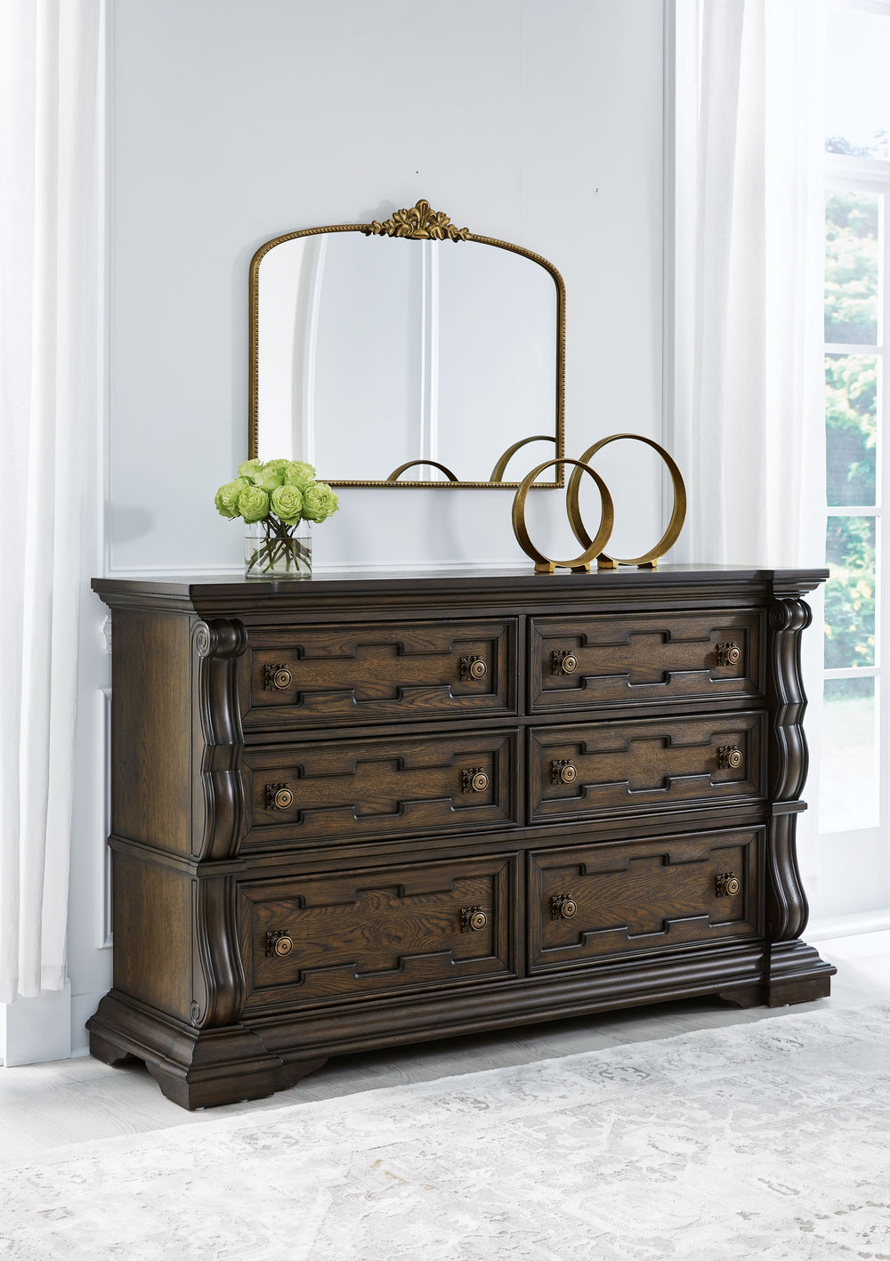 From its ornamental appliques to its large scale, this dresser makes a bold statement. Spacious drawers store your clothes, jewelry and more in stunning style. The look is timeless. The feel? Right at home.<br><br><b>Additional Dimensions</b><br><ul><li>T