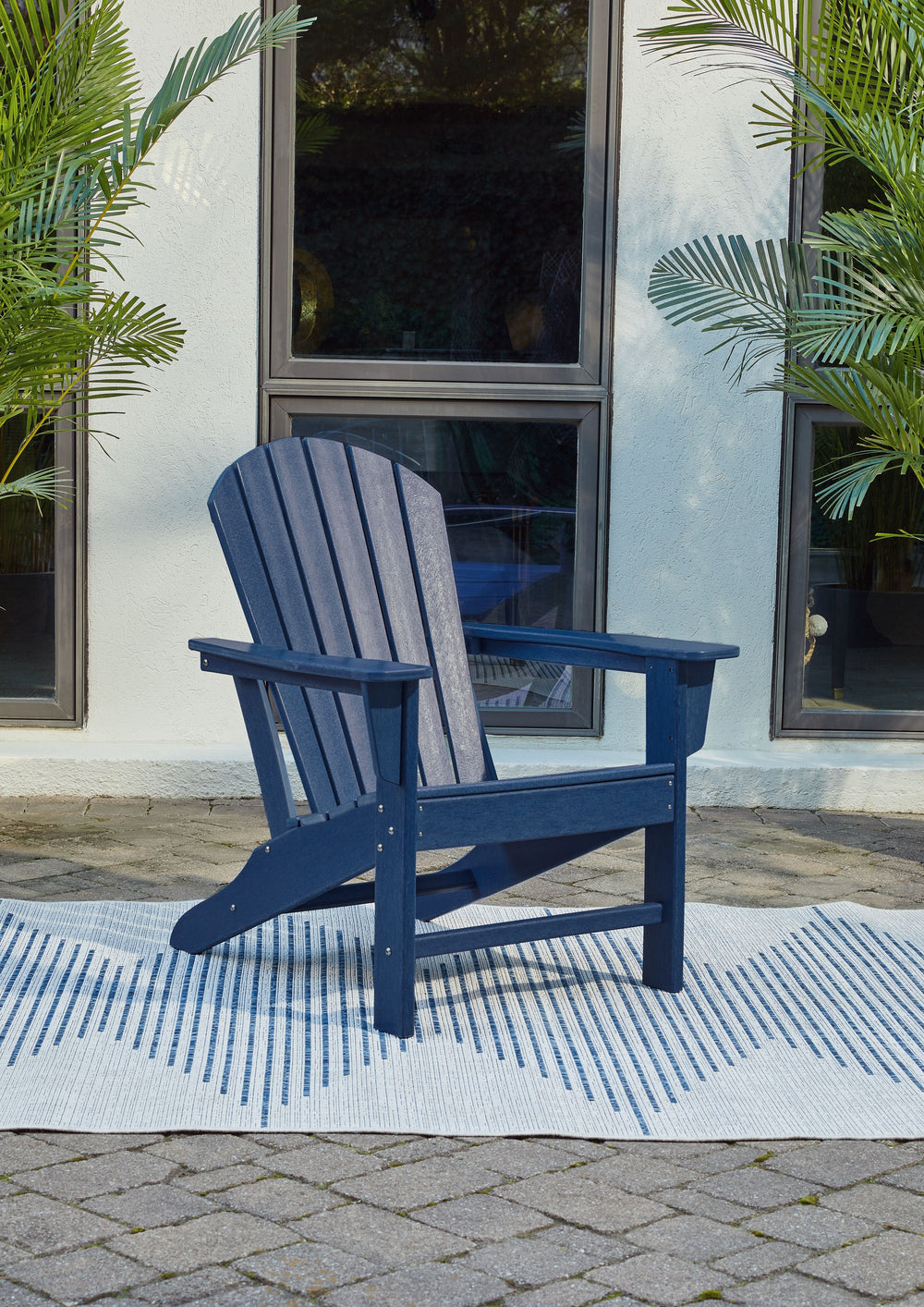 Add cottage-quaint charm to your outdoor oasis with this Adirondack chair in blue. Made of MEGA-TUFFÂ® high-density polyethylene material, itâ€™s sure to weather the seasons beautifully. Designed to shed rainwater, the chairâ€™s slatted styling with shell