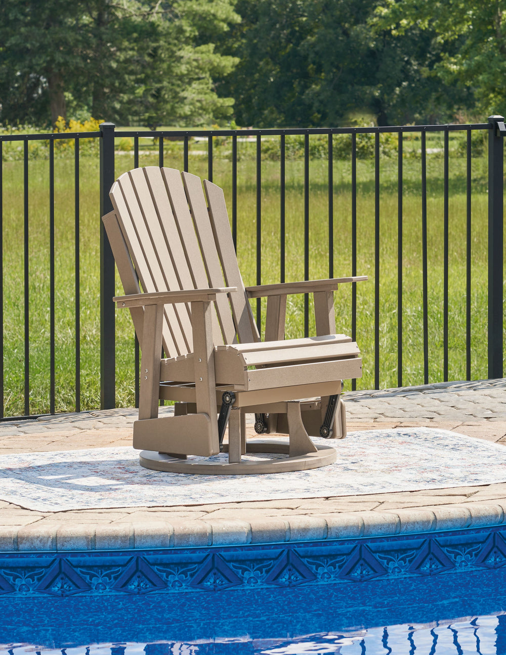Drift away from everyday worries and into outdoor bliss with this swivel glider chair. Dressed in an inviting driftwood hue, the Adirondack-inspired design has a classic feel. It weathers sunny summer days and cozy winter nights with durable MEGA-TUFFÂ® H