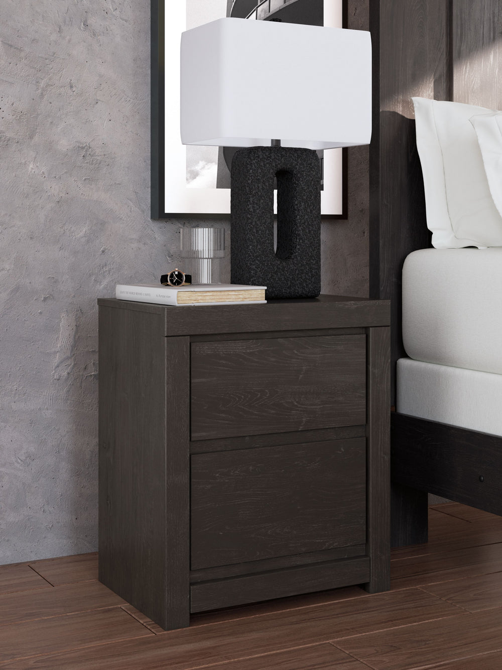 Find serene simplicity in the clean lines and dark neutral tones of this nightstand. Itâ€™s a sincere approach to modern elegance, giving you high style at a great value. A sleek hardware-less design creates a fuss-free look. Winding down before bed? Keep