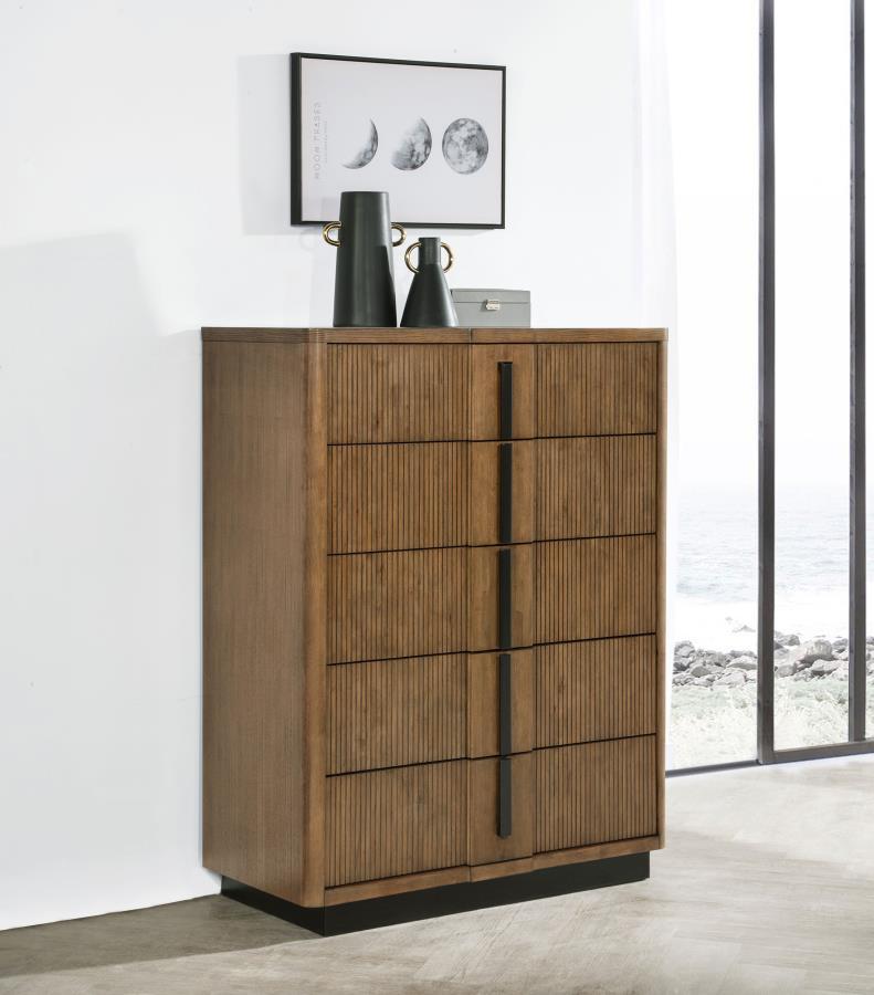 Dark vertical pulls and a matching recessed base create eye-catching dimension and depth for a modern wooden chest of drawers. Its roomy interior storage, in five drawers, is ideal for clothing, linens, and accessories. Its roomy top adds a space for styl