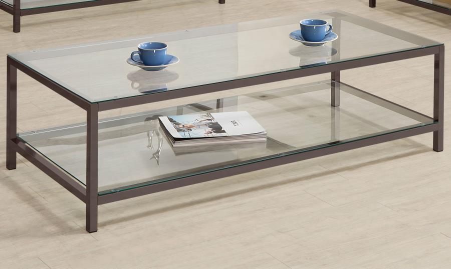 Sleek and contemporary, this coffee table pairs a black nickel electroplated frame with clear tempered glass surfaces. Its spacious tabletop and matching lower shelf provide ample room for storage or display, ideal for modern living spaces. The minimalist