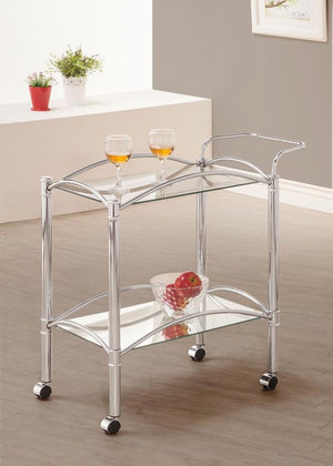  its metal frame receives romantic curved accents. A tempered glass top shelf and mirrored bottom shelf acco