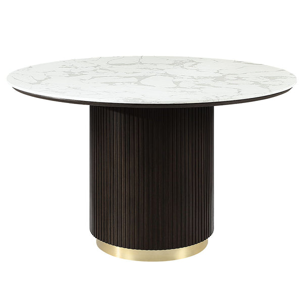  supported by a single pedestal base adorned with metal trim. Accompanied by upholstered chairs and a server with sleek metal legs