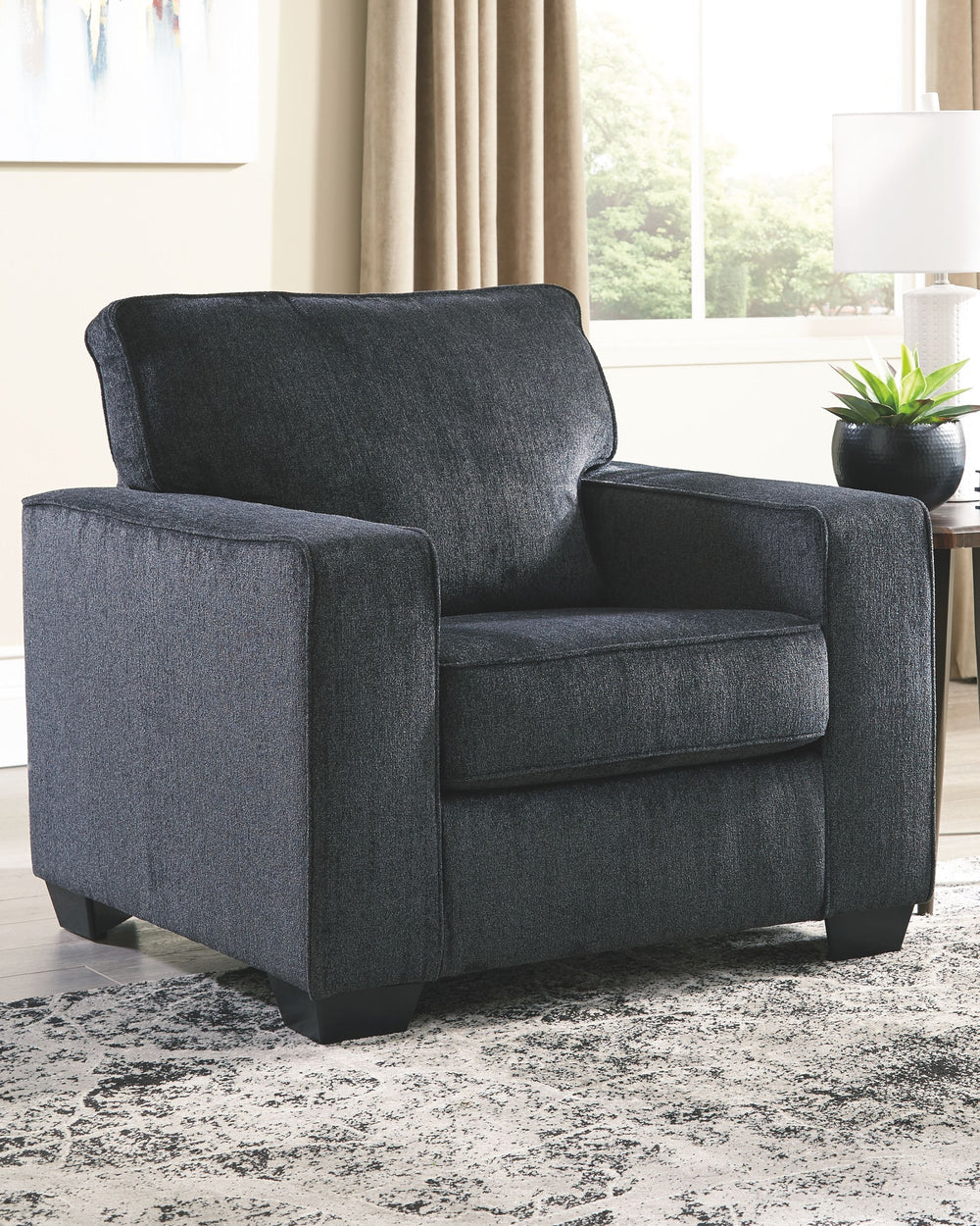  then this chair is the answer. Its decidedly contemporary profile is enhanced with plump cushioning and a chenille-feel upholstery that-'s so pleasing to the touch. Rest assured