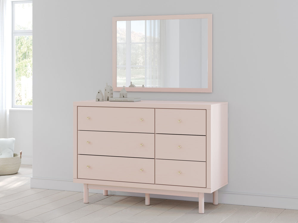 Pretty in pink. This dresser with mirror keeps the spirit of your homeâ€™s modern aesthetic while suiting all your young oneâ€™s needs. Its subtle blush finish brings a playful, charming vibe to organizing clothes and other essentials. Made for her and st