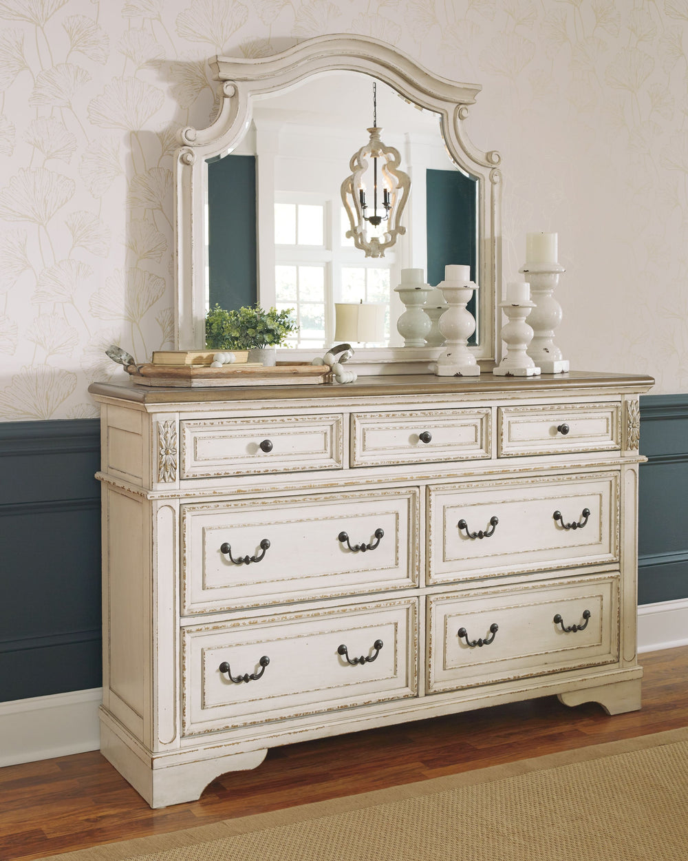 Traditional cottage design. Antiqued two-tone finish featuring chipped white cases with distressed wood finished tops. Tops feature Oak veneers, while the cases are made with engineered wood substrates and Poplar solids. Framed drawer fronts and overlay d