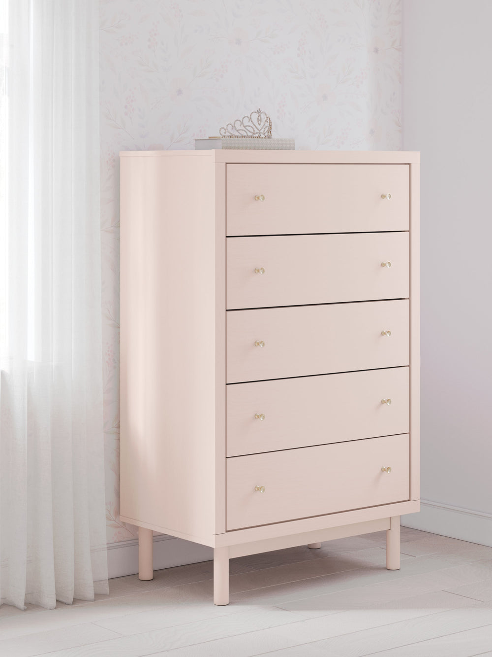 Pretty in pink. This chest of drawers keeps the spirit of your homeâ€™s modern aesthetic while suiting all your young oneâ€™s needs. Its subtle blush finish brings a playful, charming vibe to organizing clothes and other essentials. Made for her and style