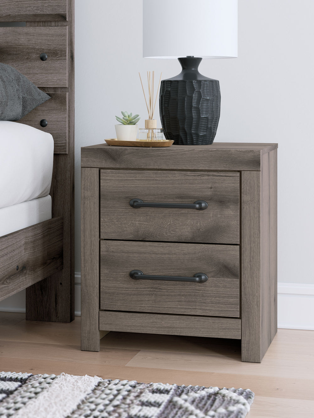Combining a casual aesthetic with functional flair, this nightstand suits styles from rustic to industrial. Its smooth-gliding drawers store essentials with ease. Ready to recharge? Included USB ports allow you to keep go-to devices close. Dressed in a ch