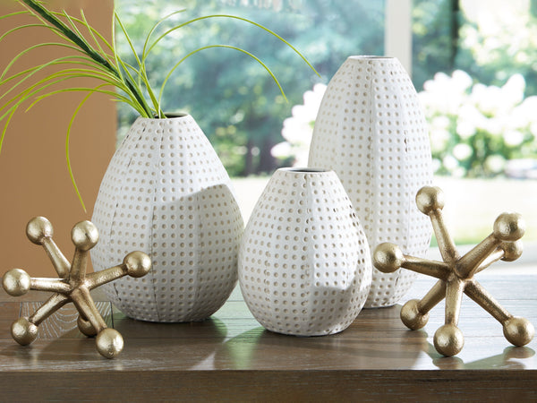  contemporary design with this accessory collection. The sculptures and vases take the classic color combination of white and goldtone and bring it to the present with decidedly modern silhouettes. With pieces in a variety of sizes