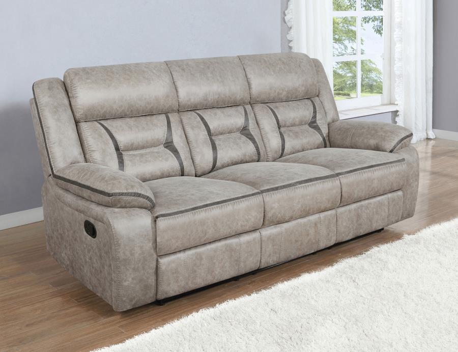 A motion sofa with a drop down center will serve you well in your entertainment space. Leatherette upholstery is enhanced with stitching details that make an impact in the craftsmanship. Pocket coil cushioning keeps you comfortable and cozy for hours of e