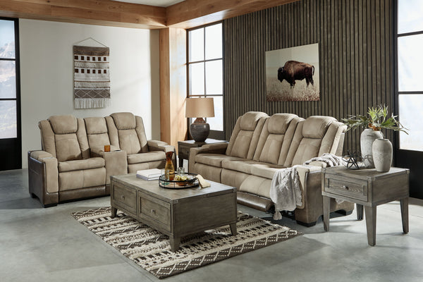  the reclining sofa with drop-down table has the upscale look of leather at a scaled-down faux leather price. Its two-tone upholstery is more 