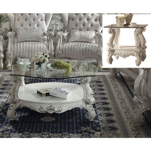  Coffee Table w/Curved Glass Top â€¢ Open Compartment: Bottom Shelf â€¢ 10mm Clear Tempered Glass w/Beveled â€¢ Oversized Scrolled Legs & Shelf Apron: Poly Resin with Antique Contrast Finish<br/><br/><b>Product Features</b><ul><li>Coffee Table w/Curved