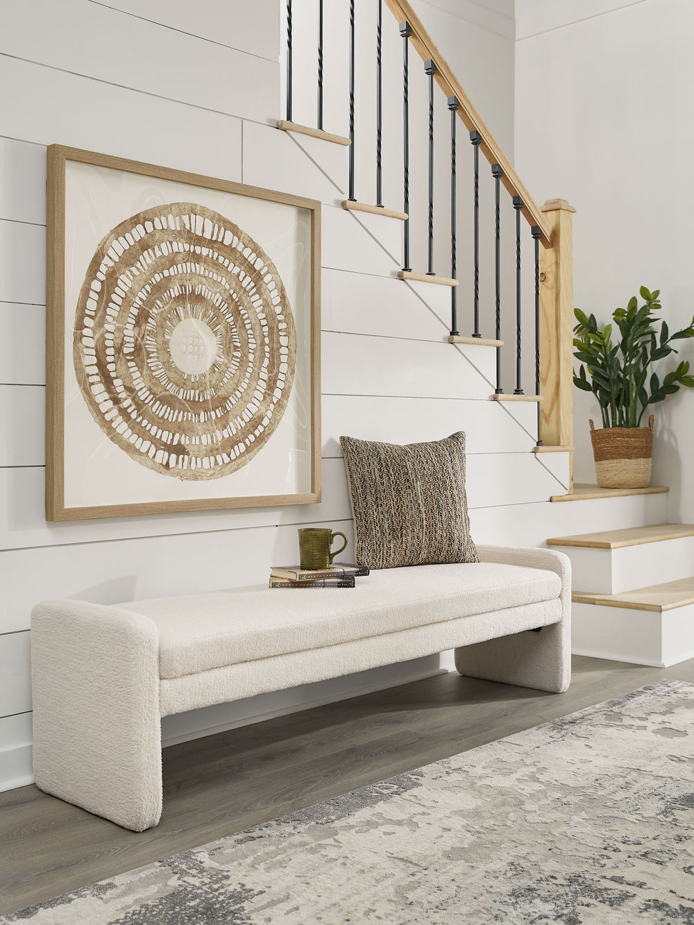 This accent bench helps you craft a cozy space without sacrificing the high-style vibe you love. Clean lines and a simple silhouette give it a contemporary, tailored feel. Inviting faux shearling fabric and rounded edges soften the look. Whether it-'s at 