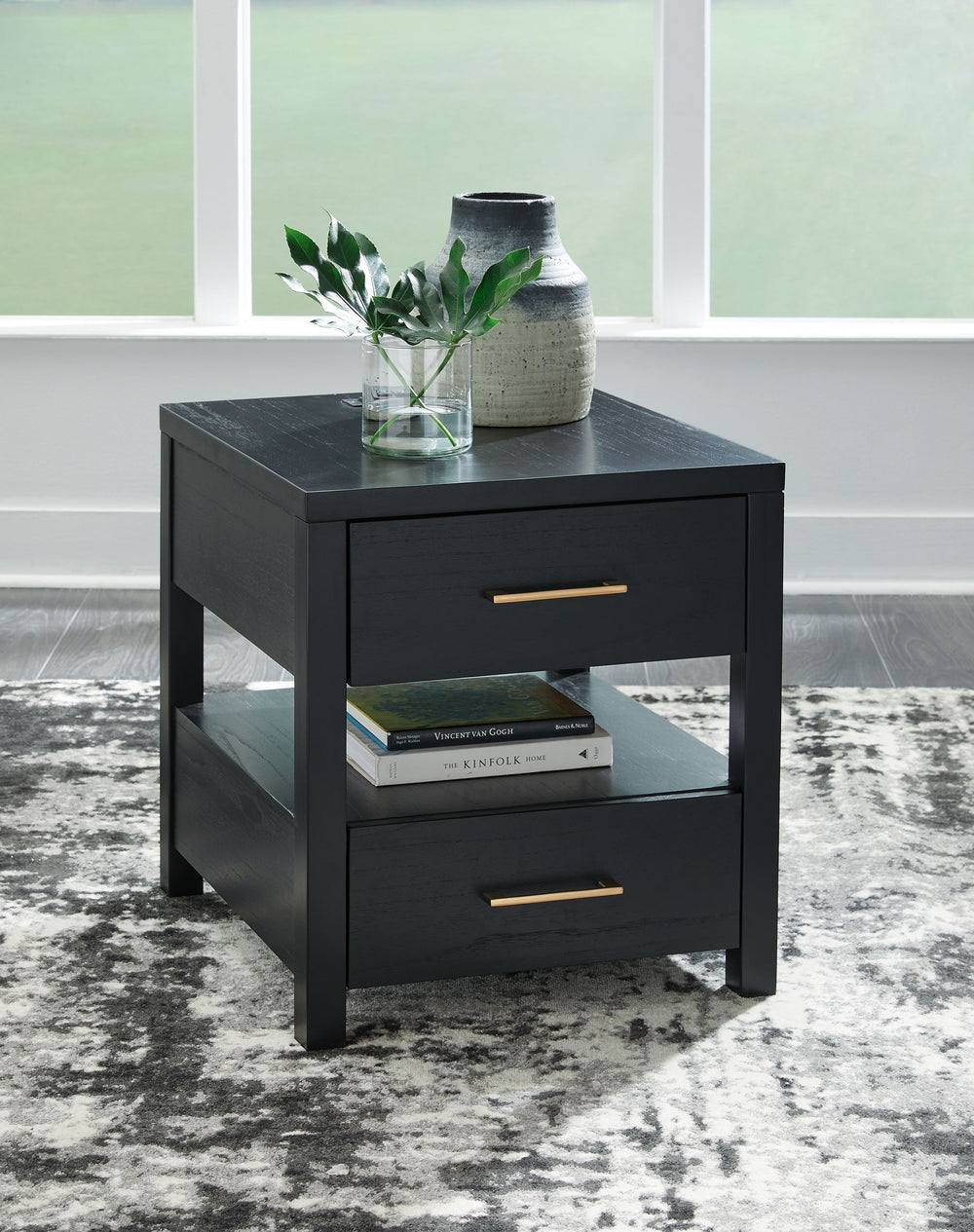 If you are a lover of simplicity, this end table is the perfect choice. Its black finish, casual contemporary design and spacious storage capacity provide functional style wherever itâ€™s displayed. And with conveniently located USB charging ports, this t