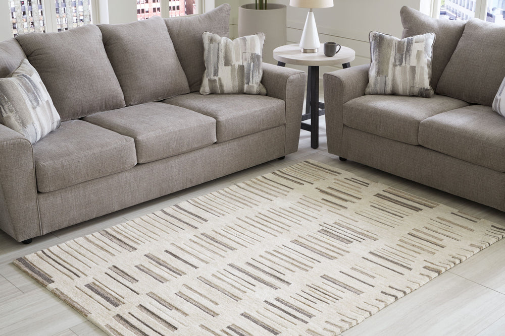 Need a centerpiece for your contemporary space? This area rug, with its high-low stripe design, captures the essence of designer styling. And its durable materials will endure the rigors of daily wear and tear. Set the scene with this rug for an unforgett