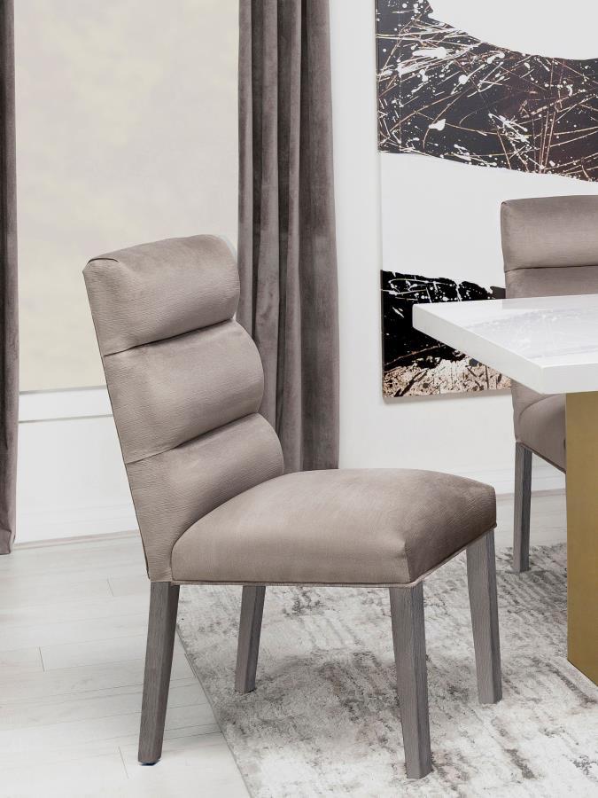 A pillowy look and feel brings ultimate comfort to a casual living space, targeting your kitchen or dining room with a light, floaty vibe, and adding a festive feel. This set of two side chairs checks all the boxes of design, comfort, and easy-living eleg