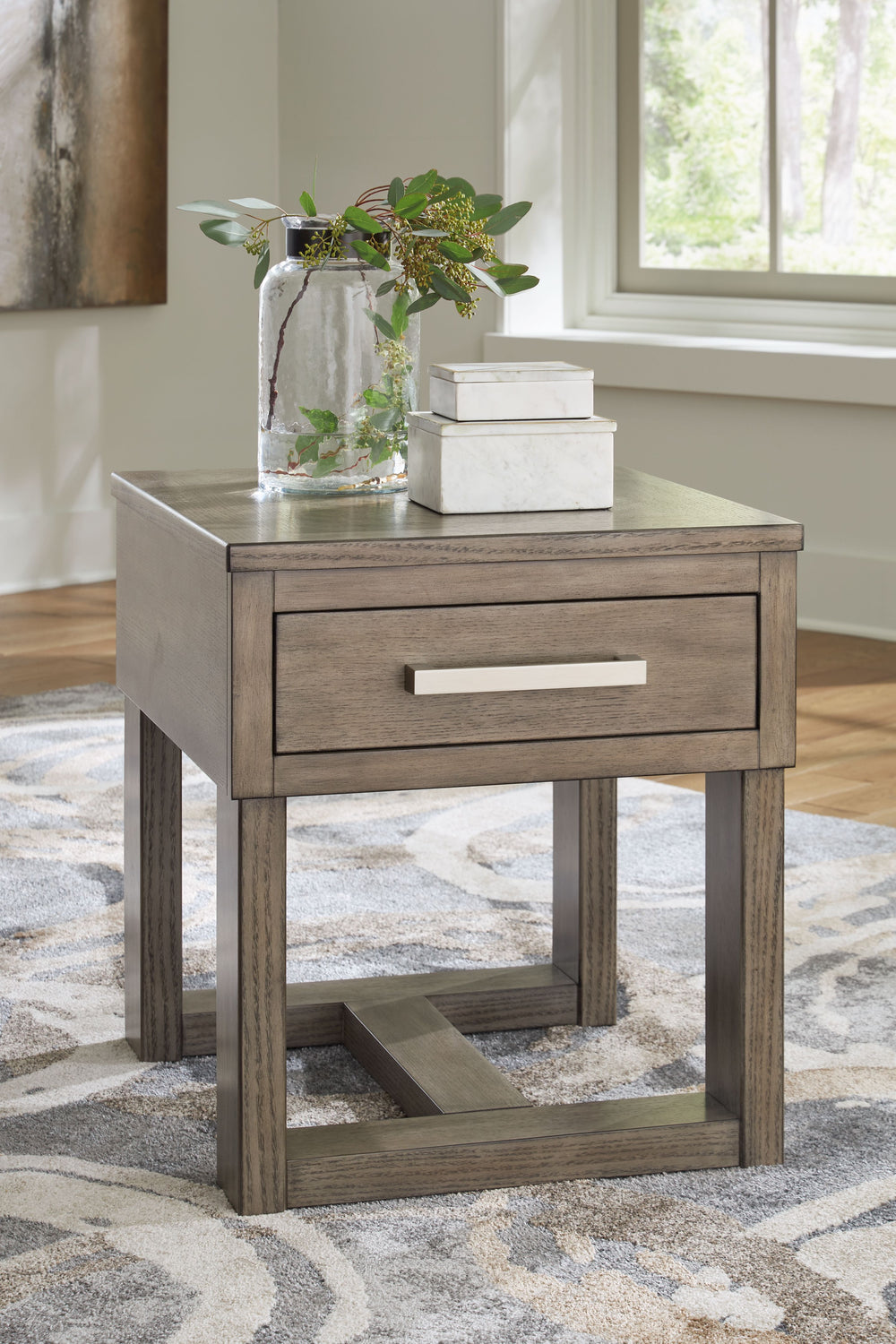 Welcome a sidekick full of casual, contemporary style and functionality to your home. This end table is exceptionally handy for storing necessities next to your sofa or accent chair, and its USB charging makes powering your devices a breeze. Finished in a