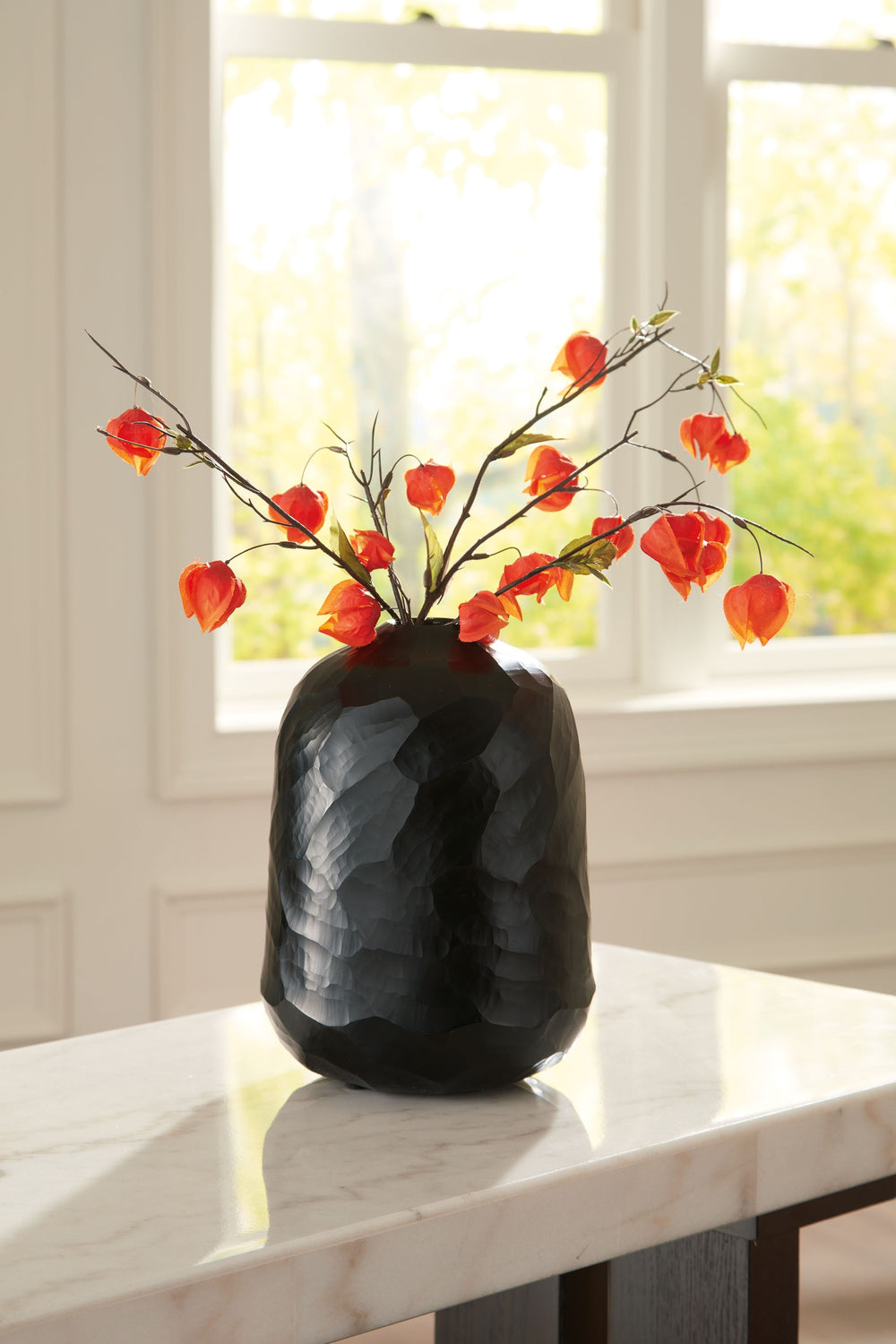 Put the accent on contemporary style with this vase. Wowing with multiple hand-carved facets, the cool black glass delivers true textural appeal from every angle. Itâ€™ll bring an artful touch wherever you see fit.<br/><br/><b>Product Features</b><ul><li>