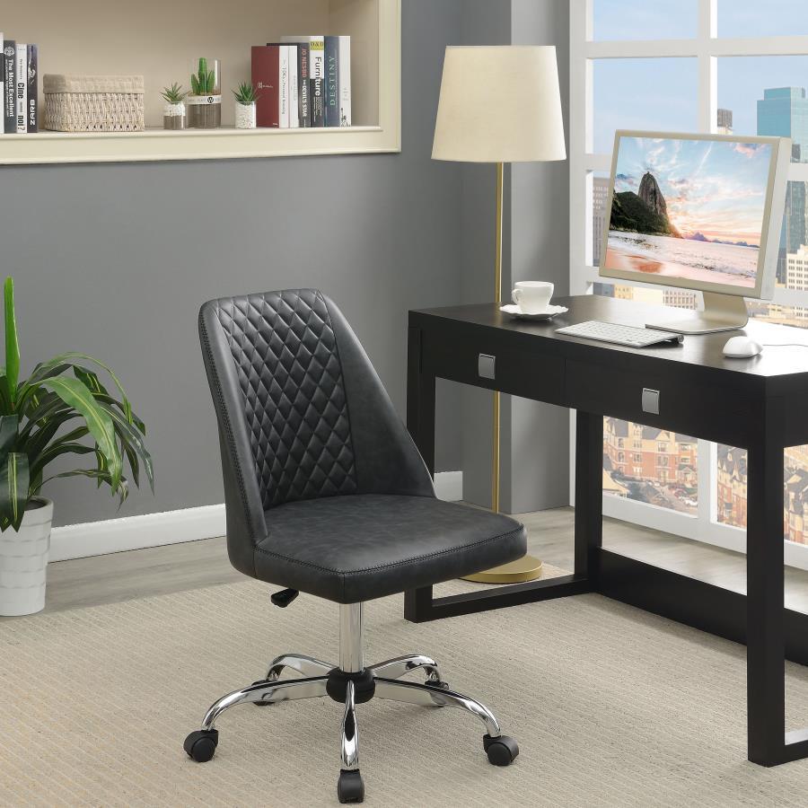 Pull this contemporary accent chair up to a workstation in your home office. Wrapped in a supple leatherette, this office chair features a bucket style seat with a diamond tufted backrest and a smooth cushion. Capable of getting around the office, this ch