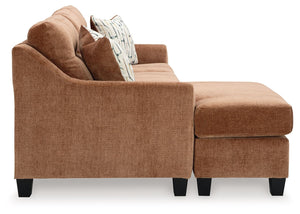  finesses the piece with just the right touch. Gently flared arms and tufted back cushion