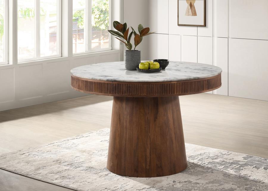 Introduce elegance into your dining space with our round white marble top dining table. The luxurious marble top adds a touch of sophistication, while the solid mango wood base with vertical fluting detail enhances the overall aesthetic. This exquisite ta