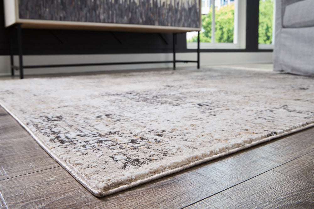 This area rugâ€™s abstract design provides a perfectly imperfect spin on contemporary style. Its plush pile delivers a wonderfully unique tapestry of tone and visual texture. Whether your style is classic or contemporary, the simply chic aesthetic goes wi