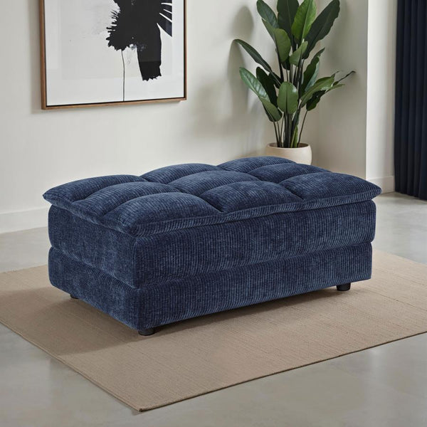 offering both style and function. Upholstered in soft blue corduroy fabric with a pillow top grid-tufted design