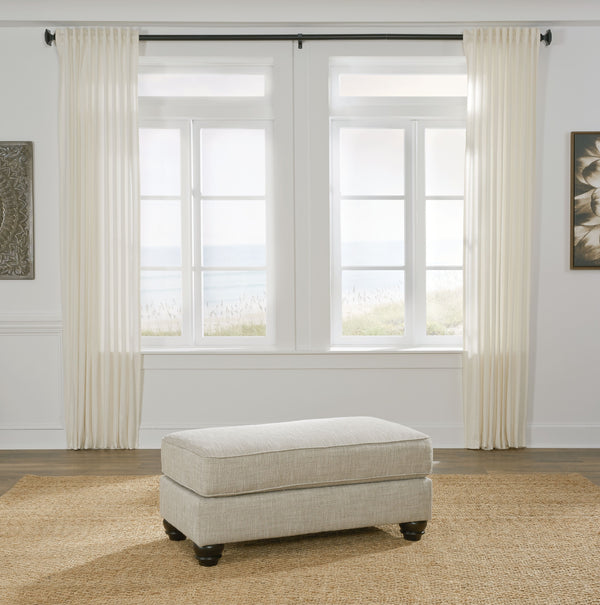  this ottoman cradles your tired feet at the end of a long day. The distinctive look of heavily textured fabric in a light