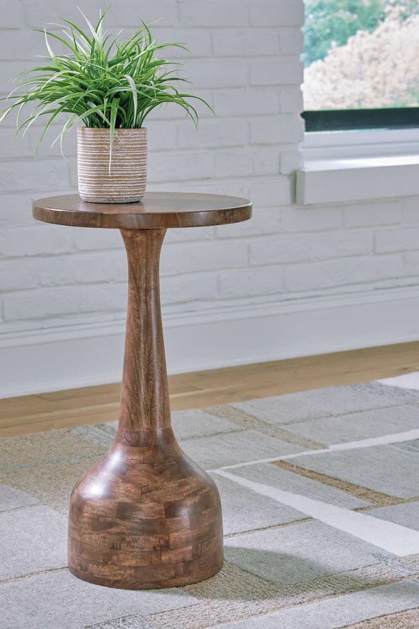  this accent table highlights the simple refinement of wood. Its slim-turned design slides expertly between chairs or next to a wall
