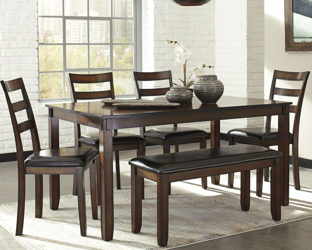 Feast your eyes on how beautiful simplicity can be. This dining room table setâ€™s wonderfully clean-lined profile is dramatically enriched with a complex, burnished finish loaded with tonal variation and rustically refined character. Upholstered ladderba