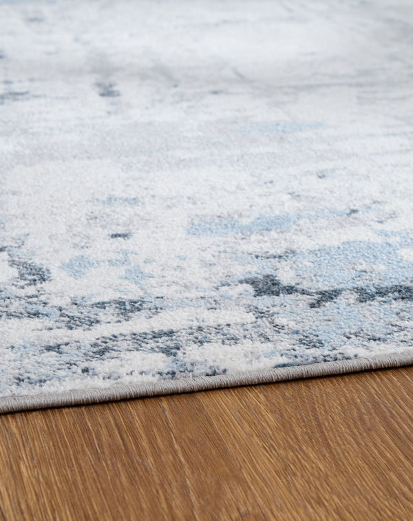  gray and white dance across this plush floor covering