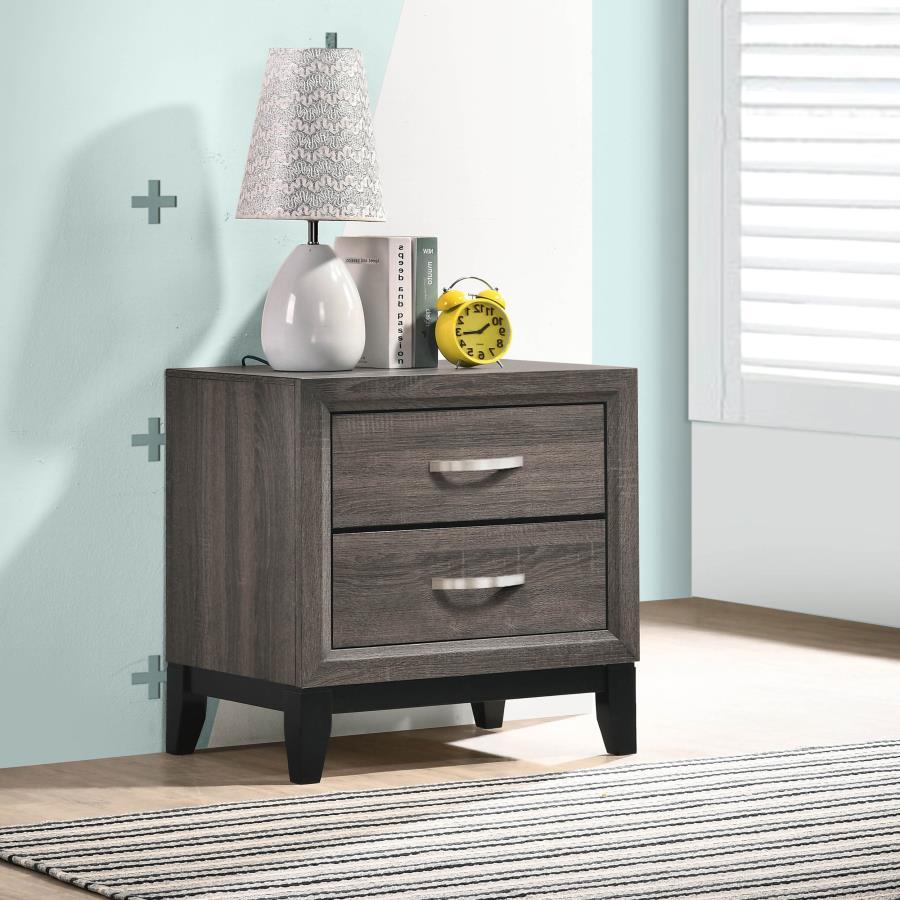 A contemporary take on mid-century modern design, the color blocking from this grey two-drawer nightstand sets it apart from the rest. Constructed of oak, the body showcases a light, exposed wood grain that oozes sophistication. Tapered legs in a black fi