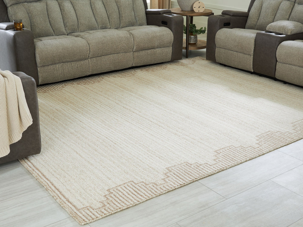 Dress up any floor with the tastefully approachable design of this rug. Its distinctive stepped border pattern, rendered in versatile neutrals, creates a subtly eye-catching look that brings modern elegance to any casual space. Crafted from wool with a ge