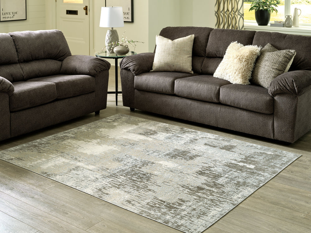 Revel in the subtly striking abstract design of this accent rug. In teal, gray, beige and taupe. it harmonizes stunningly with your existing contemporary furnishings. This rug is ready for real lifeâ€”when spills or stains happen, just toss it in the wash