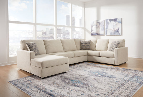  meet superior form. This sectional with chaise and ottoman are strikingly streamlined with its track arms. Cozy cushions invite superior relaxation