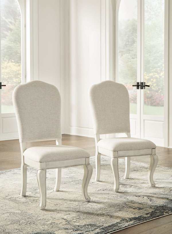 Add a touch of romance to your home with this dining chair. Its antiqued white painted finish and shapely silhouette are all about easy elegance. The graceful chair, with a cushioned back and seat and cabriole-shaped front legs, adds a dash of sophisticat