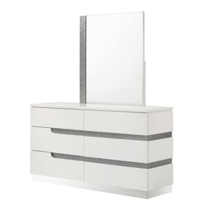 The Paradox Six Drawer Dresser in White combines contemporary appeal with robust functionality. Its gleaming white gloss laminate finish offers a sleek, modern look while providing the practical benefits of scratch and water resistance. Crafted from a com