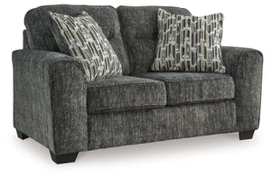 This loveseat speaks to those drawn to fresh, contemporary style with richly neutral appeal. Subtle and sophisticated, the plush upholstery and dark tri-block legs are a natural complement for so many color schemes. Two accent pillows make the seating eve