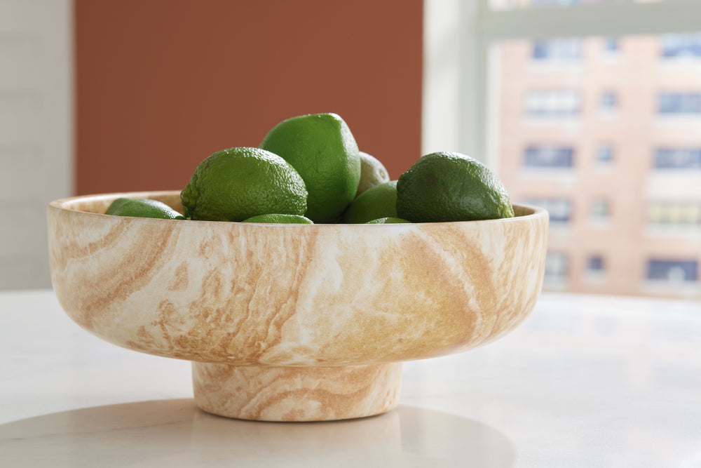Naturally flowing swirls and neutral hues give this ceramic bowl a wonderfully organic feel. Its generous size makes it ideal for showcasing whatever floats your boat. Whether itâ€™s on an entryway table, desk or bookshelf, this striking bowl is a tastefu