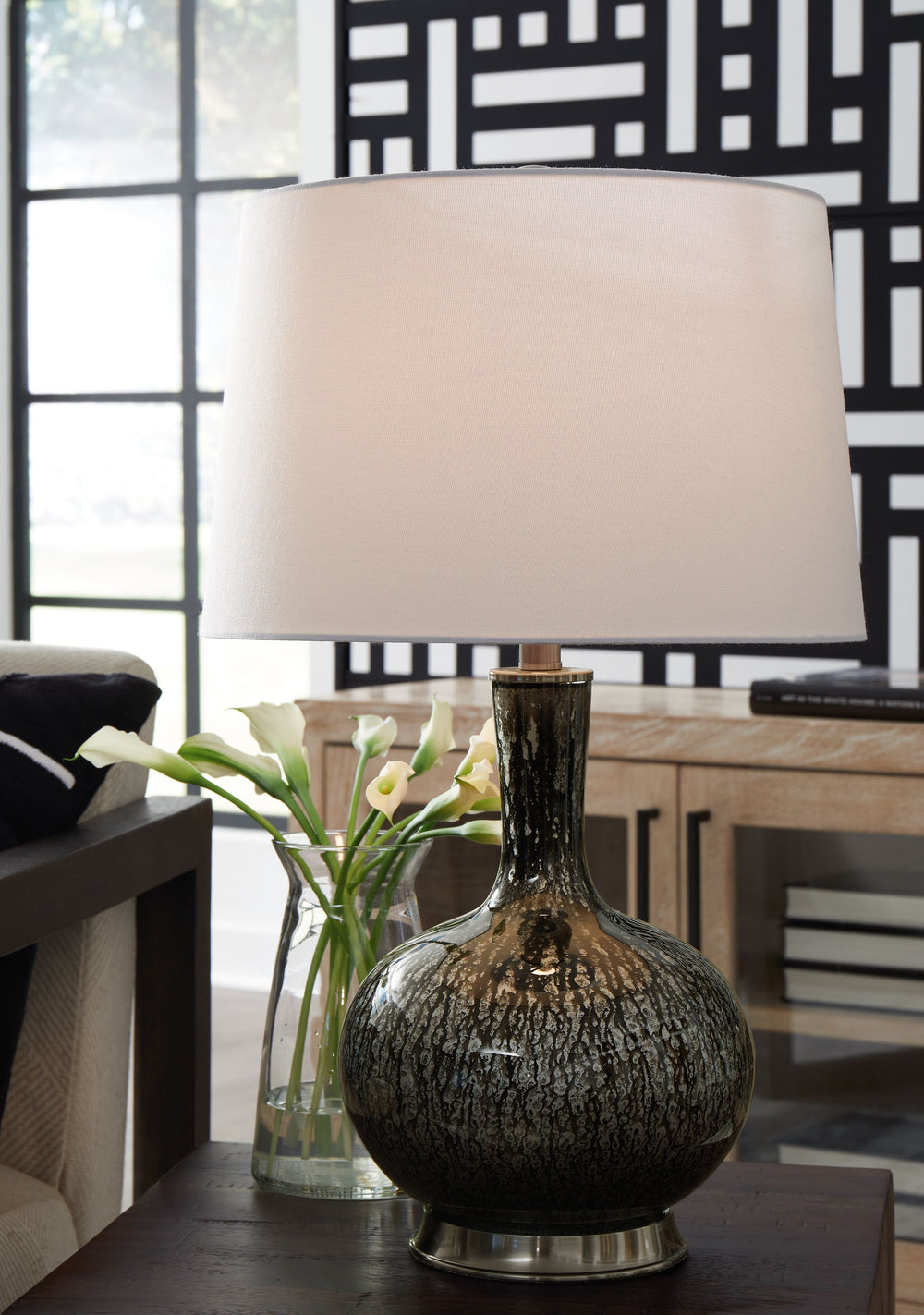This accent lamp distinguishes itself in any setting. Its dark glass body is round and distinct, providing a mood of rustic romance.<br><br><b>Additional Dimensions</b><br><ul><li>Shade: 0-"</li><li>Cord length: 103-"</li></ul><br/><br/><b>Product Feature