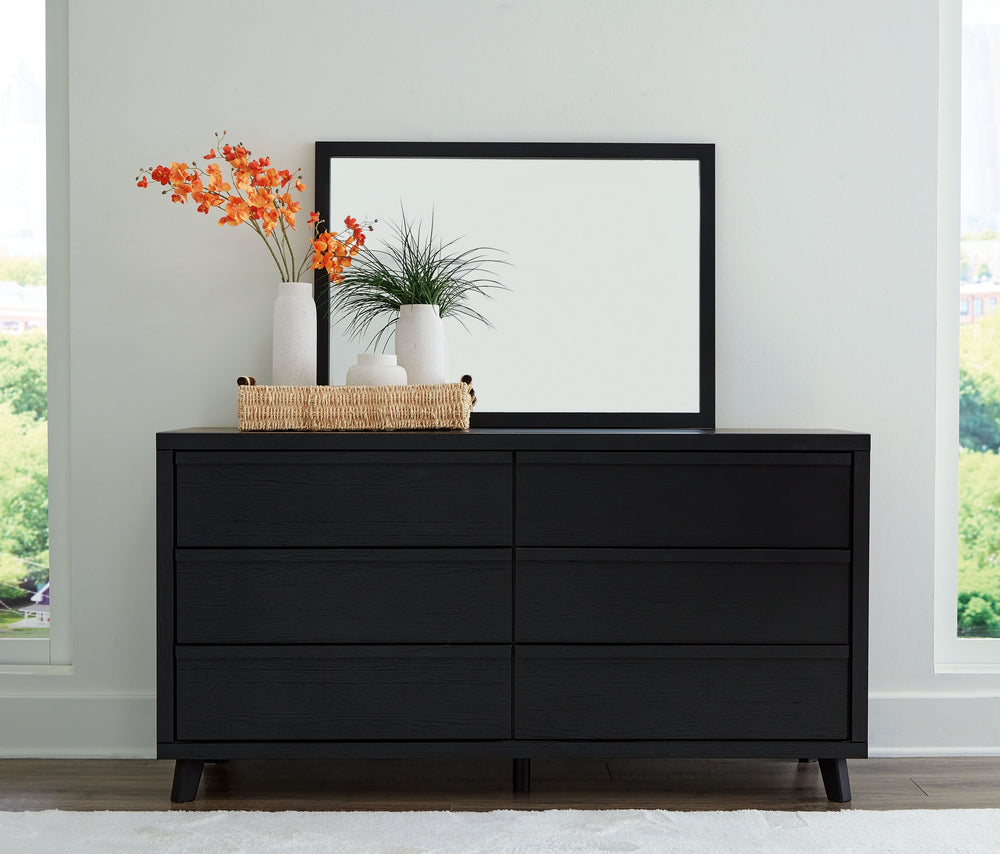 Sophisticated style for the savvy shopper. This dresser with mirror prioritizes affordable, on-trend design. Its subtle replicated texture recalls the natural beauty of wood, highlighting the slatted styling. And a matte black finish savvily suits differe